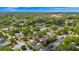 Overhead view of the home nestled among many trees in a residential neighborhood at 532 Darcey Dr, Winter Park, FL 32792