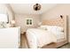 Well-lit bedroom showcases neutral tones, white shutters, wood-look floors, and a comfortable tufted bed at 532 Darcey Dr, Winter Park, FL 32792