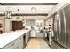 Spacious kitchen featuring stainless steel appliances, light gray cabinetry and a large center island with ample counter space at 532 Darcey Dr, Winter Park, FL 32792
