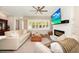 Spacious living room features a cozy fireplace, plantation shutters, and comfortable seating for entertaining guests at 532 Darcey Dr, Winter Park, FL 32792