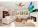 Comfortable living room with a modern fireplace, plantation shutters, and stylish decor for a relaxing atmosphere at 532 Darcey Dr, Winter Park, FL 32792