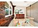 Bright flex room with accent wall, barn door and large windows offering ample natural light, and access to backyard at 532 Darcey Dr, Winter Park, FL 32792