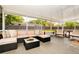 Inviting screened patio with comfortable seating, stylish décor, and ample space for outdoor entertaining with a view of the backyard at 532 Darcey Dr, Winter Park, FL 32792