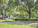 Community basketball court surrounded by lush greenery, perfect for outdoor recreation at 5354 Diplomat Ct # 105, Kissimmee, FL 34746