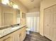 The bathroom offers a vanity with granite counter, and a shower-tub combo at 5354 Diplomat Ct # 105, Kissimmee, FL 34746