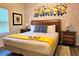 The bedroom features a queen bed with a themed mural, and neutral decor for a comfortable stay at 5354 Diplomat Ct # 105, Kissimmee, FL 34746