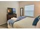 Cozy bedroom featuring a television on a wooden dresser and a window with lots of natural light at 5354 Diplomat Ct # 105, Kissimmee, FL 34746