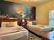 Themed bedroom with two beds, a unique mural, and neutral decor for a comfortable stay at 5354 Diplomat Ct # 105, Kissimmee, FL 34746