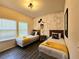Charming bedroom featuring two twin beds, themed decor and ample natural light at 5354 Diplomat Ct # 105, Kissimmee, FL 34746