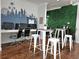 Lucaya clubhouse interior featuring desktop computers, seating options, and a lush green wall at 5354 Diplomat Ct # 105, Kissimmee, FL 34746