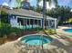 Relaxing community spa area with hot tub and clear view of the pool at 5354 Diplomat Ct # 105, Kissimmee, FL 34746