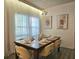 Beautiful dining room with seating for six and lovely natural lighting at 5354 Diplomat Ct # 105, Kissimmee, FL 34746