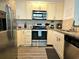 Well-equipped kitchen featuring stainless steel appliances and granite countertops at 5354 Diplomat Ct # 105, Kissimmee, FL 34746