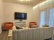 Bright living room with modern furniture, sleek TV, and plush seating at 5354 Diplomat Ct # 105, Kissimmee, FL 34746