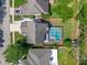 An aerial view shows the property with a pool at 5388 Birchbend Loop, Oviedo, FL 32765