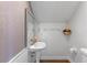 Functional half-bathroom boasting a pedestal sink, neutral decor, and convenient amenities at 5388 Birchbend Loop, Oviedo, FL 32765