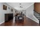 Dining room with hardwood floors, ceiling fan, and staircase at 5388 Birchbend Loop, Oviedo, FL 32765