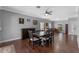 Spacious dining room featuring hardwood floors, a ceiling fan, and neutral paint colors at 5388 Birchbend Loop, Oviedo, FL 32765