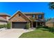 Charming two-story brick home featuring a well-manicured lawn and a two-car garage at 5388 Birchbend Loop, Oviedo, FL 32765