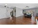 Bright living room with staircase, view of backyard pool, and stylish hardwood floors at 5388 Birchbend Loop, Oviedo, FL 32765