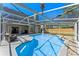 Gorgeous screened-in pool with lounge area, perfect for relaxation and entertaining at 5388 Birchbend Loop, Oviedo, FL 32765