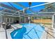 Relaxing screened-in pool, deck with outdoor seating, and view of the backyard and fencing at 5388 Birchbend Loop, Oviedo, FL 32765