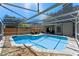 Stunning screened-in pool with a spacious deck and a lush backyard view at 5388 Birchbend Loop, Oviedo, FL 32765