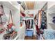 Organized walk-in closet with shelving, hanging space, and lots of storage at 5395 Emerald Isle Drive # 1011, Orlando, FL 32812