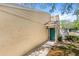 This home boasts a beautifully kept yard and inviting doorway, perfect for a cozy and welcoming curb appeal at 5395 Emerald Isle Drive # 1011, Orlando, FL 32812