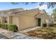 Inviting home featuring manicured landscaping and a charming entranceway, perfect for a cozy and welcoming curb appeal at 5395 Emerald Isle Drive # 1011, Orlando, FL 32812