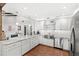 Bright and updated kitchen with stainless steel appliances, ample counter space, and sleek white cabinets at 5395 Emerald Isle Drive # 1011, Orlando, FL 32812