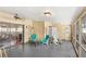 Inviting sunroom featuring comfortable seating, screened windows, and access to the home's interior at 5395 Emerald Isle Drive # 1011, Orlando, FL 32812