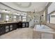 Luxurious bathroom featuring a large soaking tub, walk-in shower and dual sinks at 5640 Brookline Dr, Orlando, FL 32819
