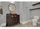 Stylish powder room featuring a vessel sink, floating shelves, and a modern toilet at 5640 Brookline Dr, Orlando, FL 32819