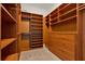 Walk-in closet with wood shelving and drawers, providing ample storage space at 5640 Brookline Dr, Orlando, FL 32819