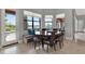 Cozy dining area with a view of the lake, complemented by built-in bench seating and stylish chairs at 5640 Brookline Dr, Orlando, FL 32819
