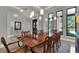 Spacious dining room with modern pendant lighting and large windows at 5640 Brookline Dr, Orlando, FL 32819