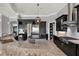 Modern kitchen with stainless steel appliances, granite counters and dark cabinetry at 5640 Brookline Dr, Orlando, FL 32819
