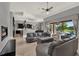 Open-concept living room with a view of the pool, featuring modern furniture and neutral tones at 5640 Brookline Dr, Orlando, FL 32819
