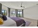 Main bedroom features plush carpeting, a ceiling fan, and views of the pool and lake at 5640 Brookline Dr, Orlando, FL 32819
