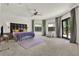 Bright main bedroom features plush carpeting, a tray ceiling, and multiple windows at 5640 Brookline Dr, Orlando, FL 32819