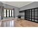 Well-lit office with built-in shelving, hardwood floors, and a large window offering natural light at 5640 Brookline Dr, Orlando, FL 32819