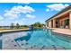 Inviting pool with comfortable seating area and golf course views at 5640 Brookline Dr, Orlando, FL 32819