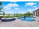 Backyard pool and spa overlooking the lake and golf course at 5640 Brookline Dr, Orlando, FL 32819