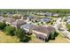 An aerial view shows a neighborhood of single-Gathering homes surrounding a small pond at 5803 Cheshire Cove Ter, Orlando, FL 32829