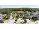 An aerial view shows a house on a cul-de-sac next to a community pond at 5803 Cheshire Cove Ter, Orlando, FL 32829