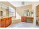 Large bathroom with dual sinks, soaking tub, and vanity area at 5803 Cheshire Cove Ter, Orlando, FL 32829