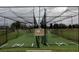 View of community batting cage with netting, rubber floor and painted white baselines at 5803 Cheshire Cove Ter, Orlando, FL 32829