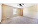 Neutral bedroom featuring standard closet, carpet flooring, and a ceiling fan at 5803 Cheshire Cove Ter, Orlando, FL 32829
