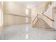 Bright living room with a soaring ceiling, a staircase, and gorgeous marble floors at 5803 Cheshire Cove Ter, Orlando, FL 32829